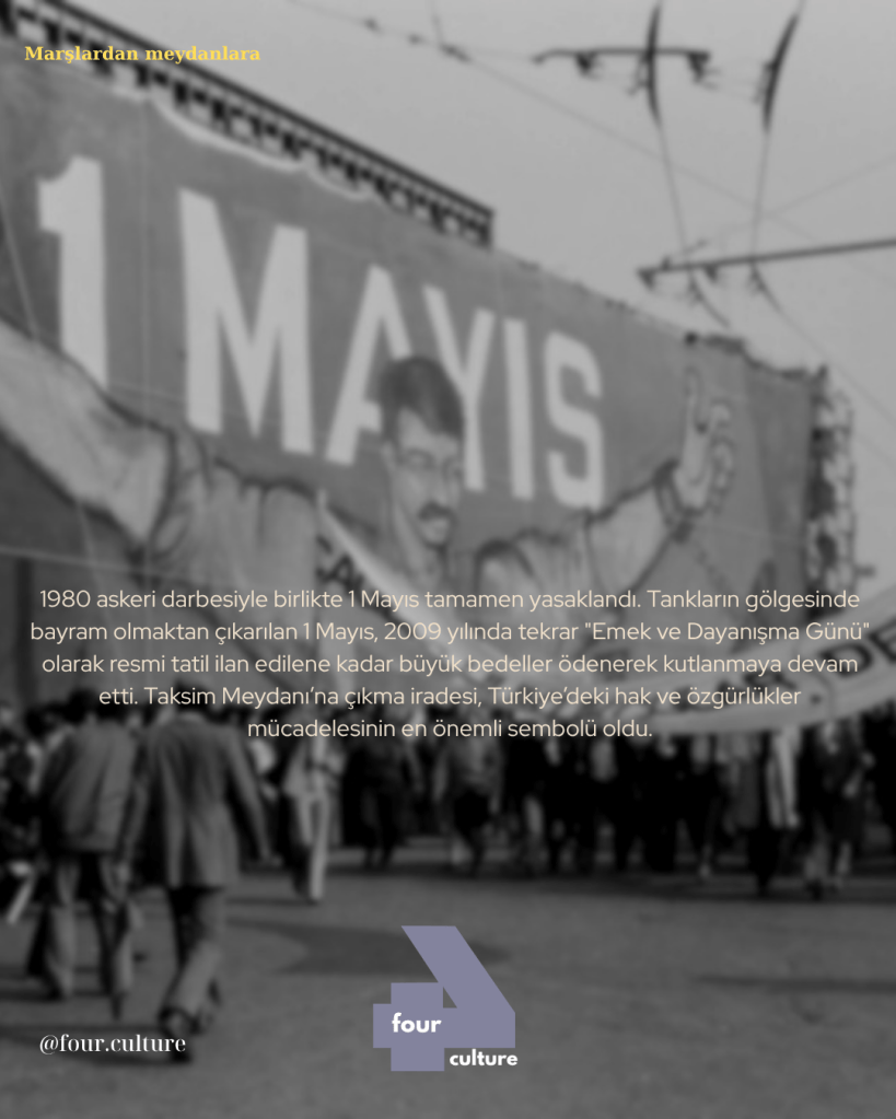 1 Mayıs Emek ve Dayanışma Günü'nü simgeleyen bir pankart ve yürüyüş düzenleyen kalabalık bir grup insan.