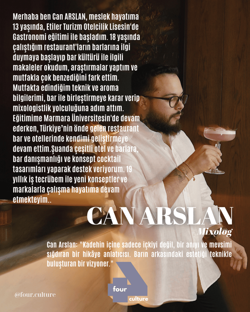 Can Arslan, kokteyl tasarımcısı ve mixolog, bir kokteyl tutarken poz veriyor. Arka planda bar ve ahşap detaylarla modern bir atmosfer mevcut.